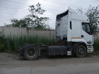 #1: Confluence: directly under the rear axle of a parked truck