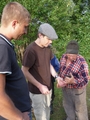 #6: Back in the hamlet trying to explain the concepts of GPS and 'confluence point' to the villagers.  Evgeny on left.