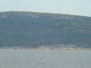 #1: Densely wooded Gogland Island seen from the Confluence