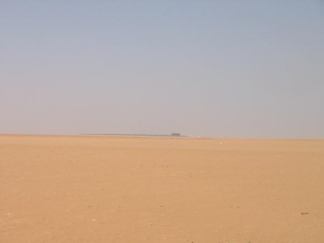 The view to the SW showing the dilapidated farm buildings