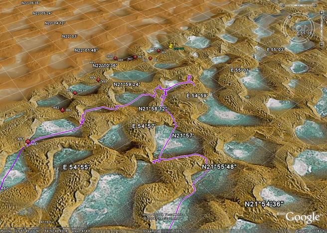 Google Earth 3D view with planned waypoints (red) and actual tracks(purple). Closest tracks are 2700 m SSW of the Confluence at 21.97668°N 54.99182°E. Better route for next time is to follow the red planned waypoints to the North.