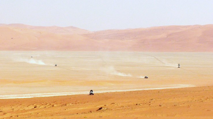 Six vehicles crossing the sabkha