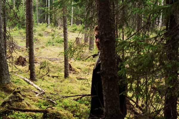 John lurking in the forest.