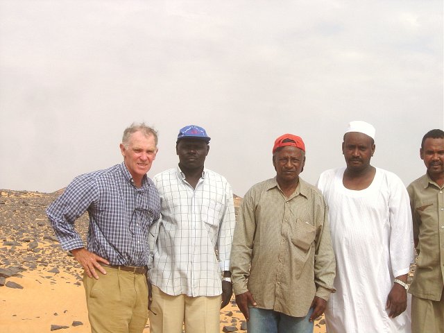 The confluence hit team at 19N 30E, Neil Munro on left, Dr Osman el-Tom 3rd from left, on an uncomfortably hot late afternoon