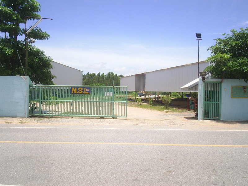 View through the gate. CP is near the piece of machinery in the background, visible under the roof.