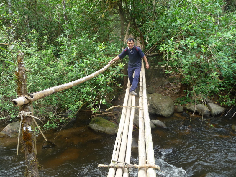 Dit Ley crossing one of the bamboo bridges near the start of our journey.