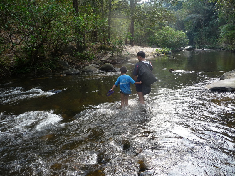 Dit Ley and his boy on one of the river crossings.