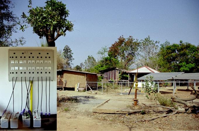 Solar charging station; insert taken in white hut in background