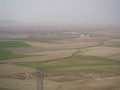 #7: General view to the NE, with Kalaba (the nearest large town). The Confluence lies in the wheat fields beyond the two large buildings in the centre right.