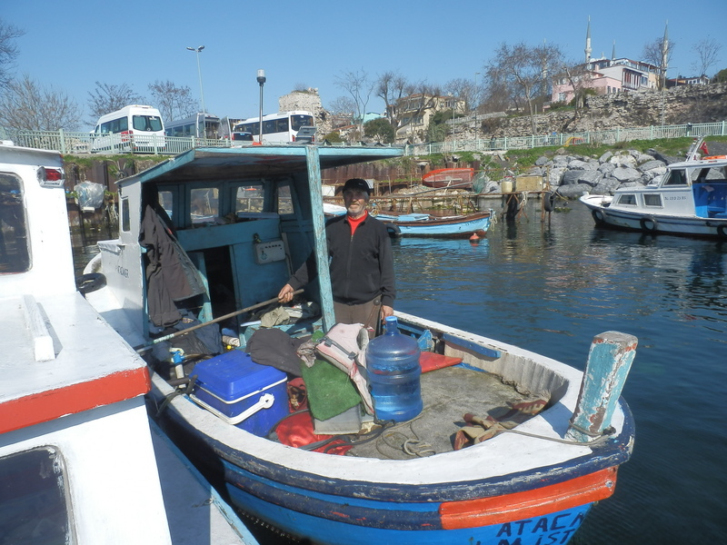 Fisherman and boat