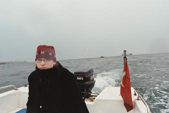 #1: Lacey, with the confluence point in the background, and sea wall on the left.