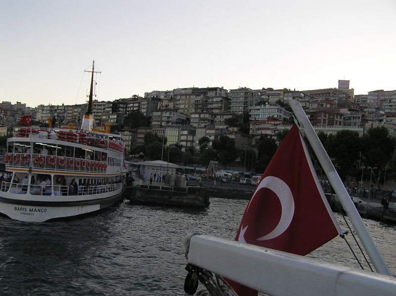 Flag on our boat's stern as we pull away from the European side.