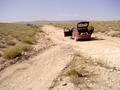 #4: Our car marks the closest point of the road to the Confluence. View to the West