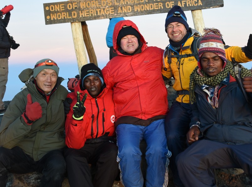 The climbing team at the summit of Kilimanjaro
