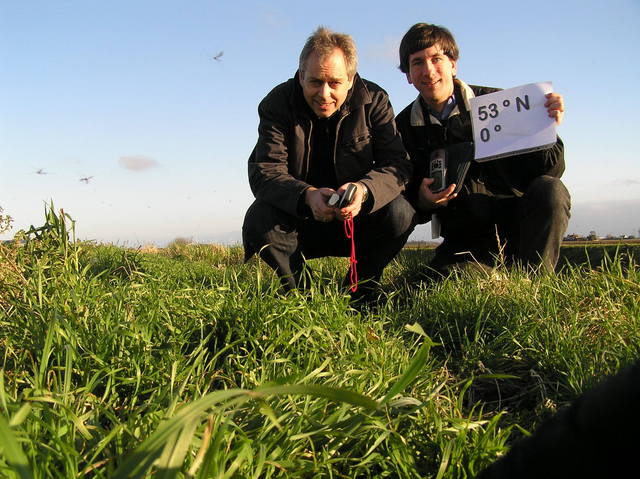 David Lambert and Joseph Kerski, with gnats visible on the left, at the confluence.