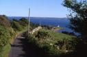 #6: Small road leading uphill, 2.7 km west of the CP. Stranraer in the background.