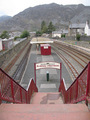 #11: Blaenau Ffestiniog railway station with both narrow guage and regular tracks.  Moelwyn Mountains in the background.