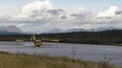 #9: Amphibious fire fighting tanker plane takes on more water at Bettles floatport (looking to NW)