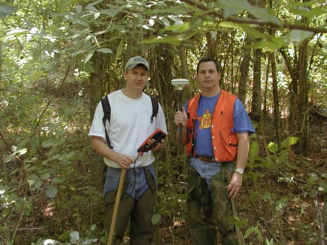 John holding antennae, and Rodney controlling a Leica GS50 GPS unit.  Note snake proof (and brush proof) chaps we are wearing.