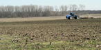 #9: A farmer tills the fields of historic Island Number Seventy.