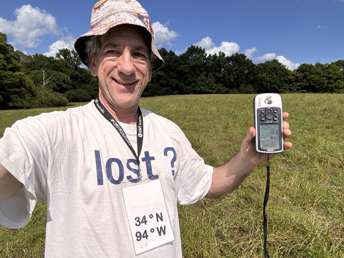 Joseph Kerski with lost shirt at the confluence point.