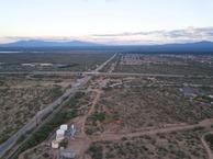 #8:  View East (along W. Pima Mine Road, across Interstate 19) from 120 m above the point