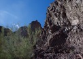 #3: Looking west towards the confluence point, 300 feet away - on the rock face behind the bush