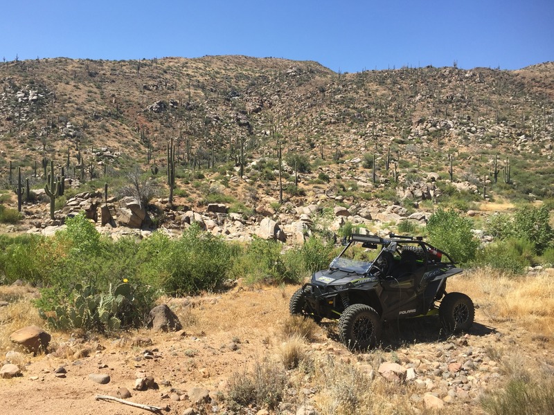 Polaris vehicle and showing the ridge to the confluence in the background.