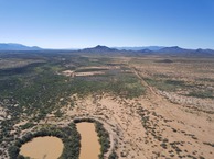 #11: View West (of the farm’s corral and stock ponds) from 120 m above the point