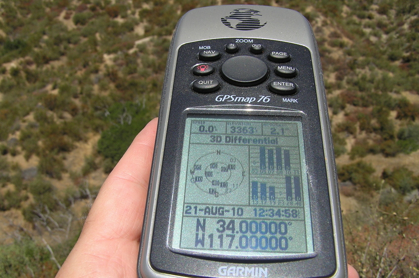 At last, success.  GPS reading at the confluence point after quite a bit of scrambling on very slippery slopes.