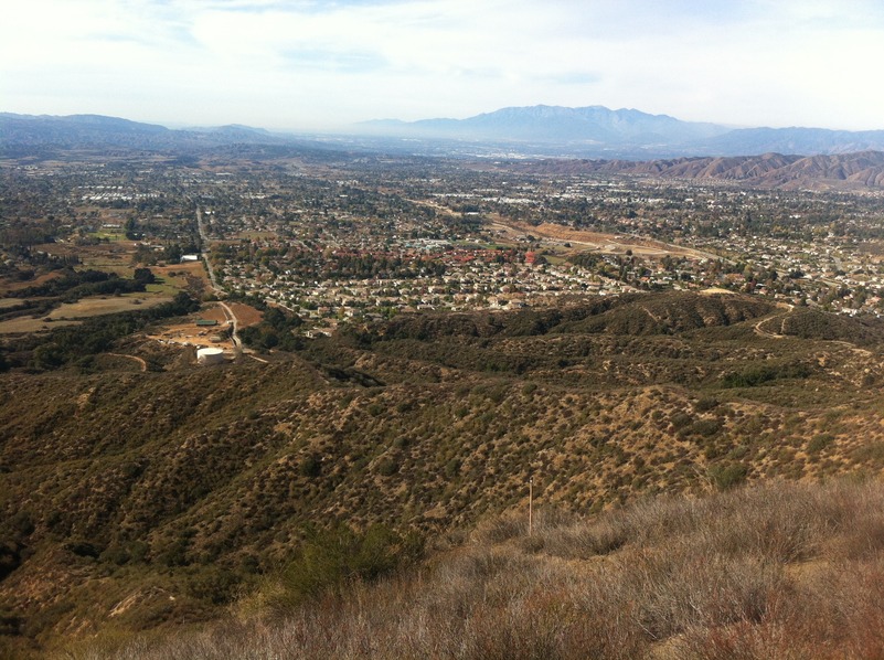 View of the confluence, on the left side of this photograph down the ravine, from the ridge to the east of the point.