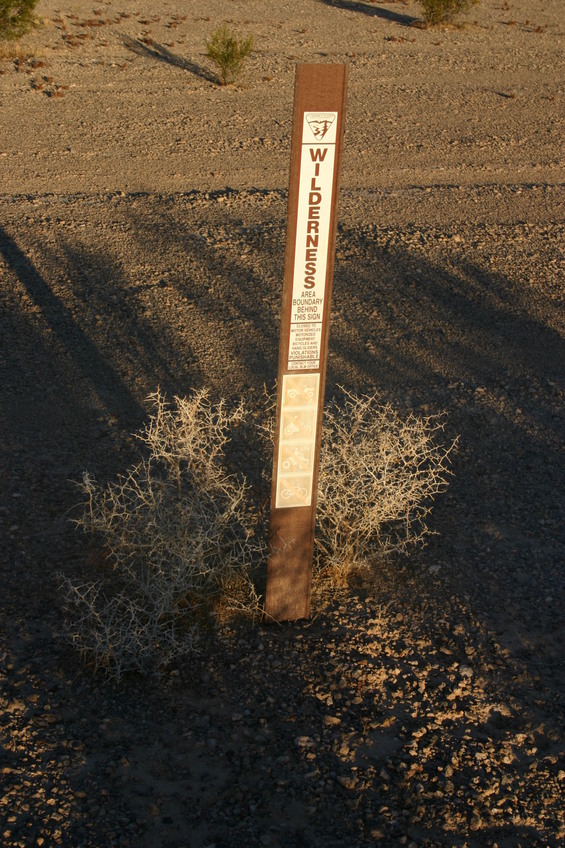 One of several markers along the dirt road. 