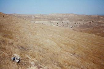 #1: Confluence marked by my hat in a view to the west.