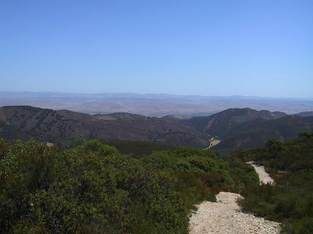 The confluence is at the level of the clearing in the middle of the picture, but a little closer.