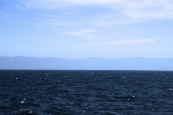 #1: Looking east towards Lopez Point.  The confluence is 21 NM @ 266 degrees true from Lopez Point.   The highest mountain on the horizon, is Cone Peak, at 5,155 ft.