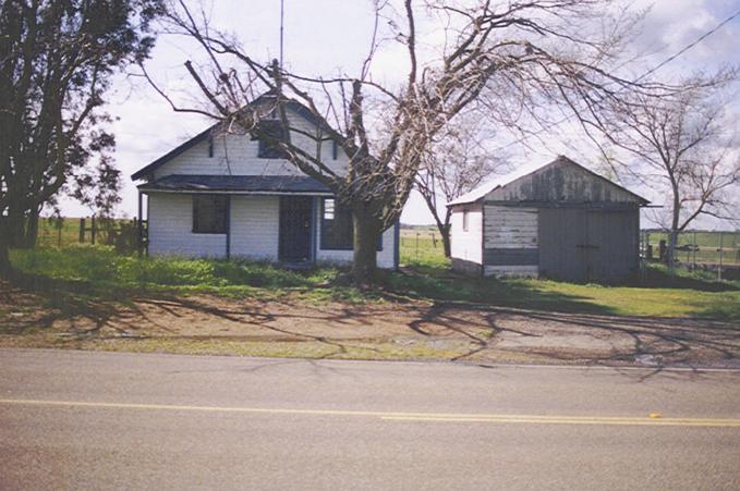 The "landmark" house across the road to the west