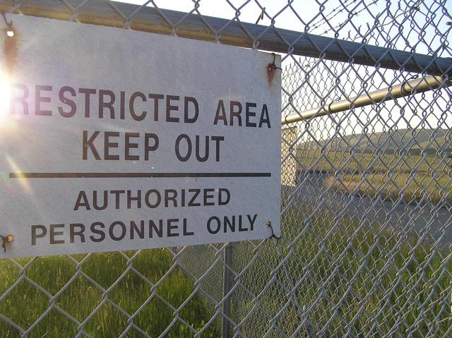 Soon to disappear?  This weapons facility has closed and the fences and signs will likely be removed someday.