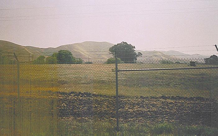 The confluence lies 50 meters inside this security fence.