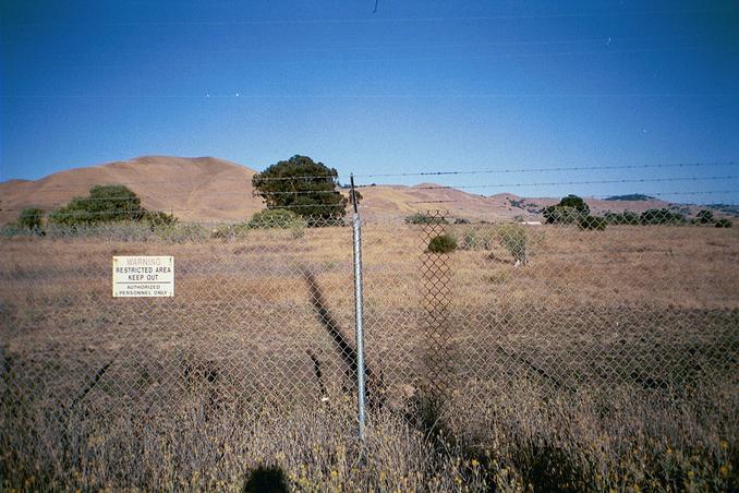 A wider view of the security fence, and confluence point beyond