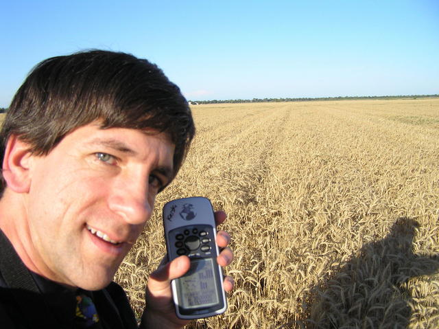 Joseph Kerski standing in the field at the confluence of 39 North 122 West.
