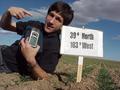 #9: Joseph Kerski, lying in the field, at the confluence site.