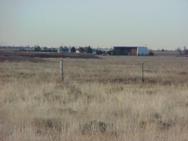 View from the confluence to the northwest, showing the nearest farmhouse.