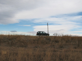 #1: North with car passing on Baseline Road