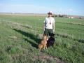 #4: Dad and the dogs, with a farm in the background.