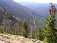 #8: From atop the ridge 1.3 km west of the confluence, looking west on the starting point, the road.