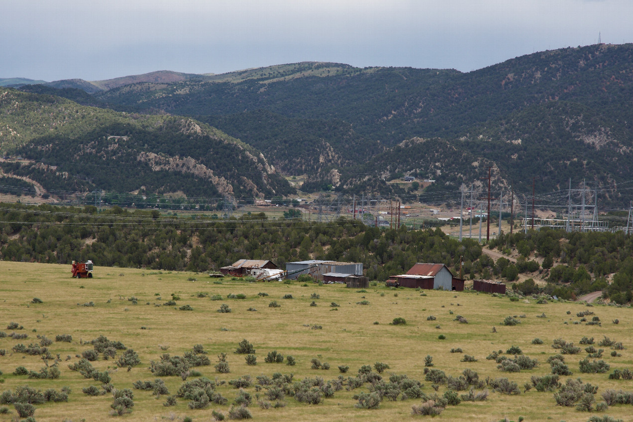 A close-up view of the old farm buildings - with the electricity distribution system beyond - visible to the northeast of the point