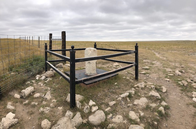 View from Colorado of the point where CO/WY/NE come together.  Nebraska high point in the distace on the right, WY behind the fence of the left 