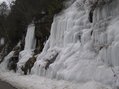 #7: Stalactites of ice flowing from roadside ledges