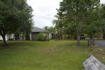 #1: The confluence point lies just 50 feet away, in this home's front yard.  (This is also a view to the West.)