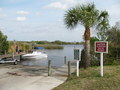 #6: Within a mile of the confluence people are bringing in their boat from Widden Bay. Caution! Watch for alligators.